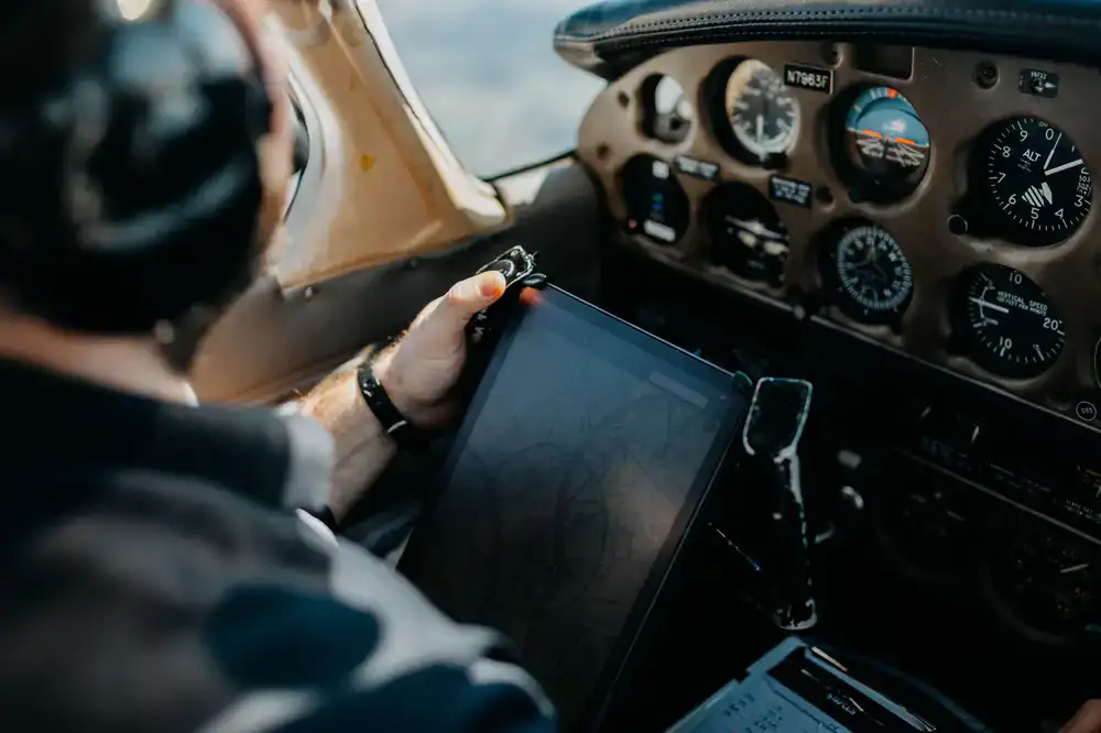 Flight instructor reviewing telemetry data on a tablet